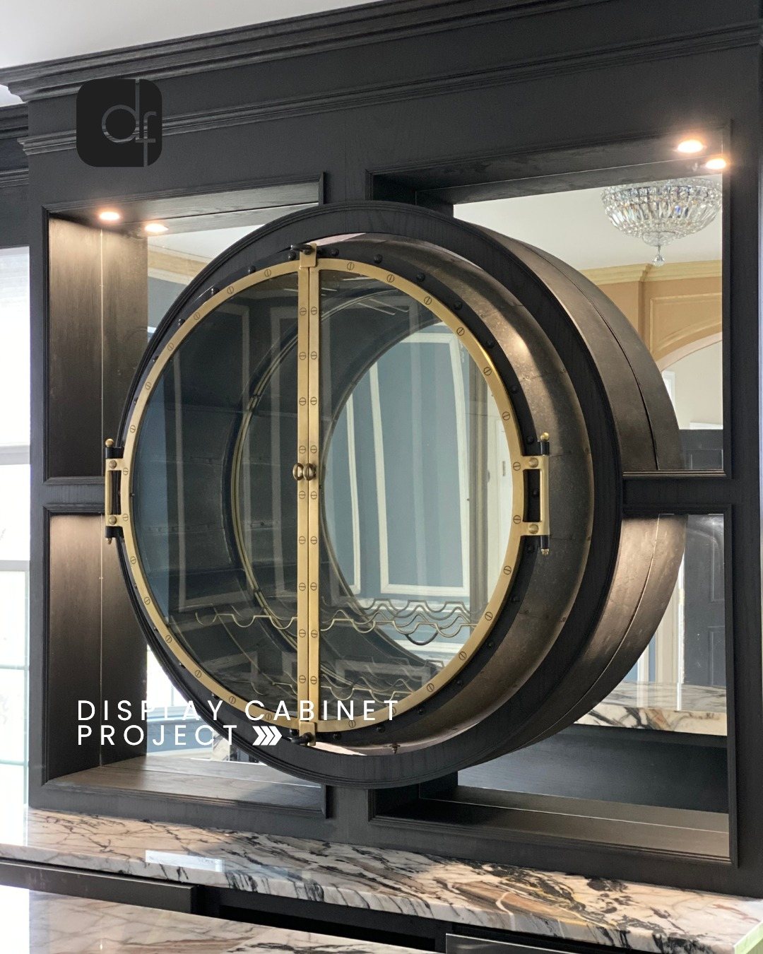 Bar with dramatic veined marble and brass mirror